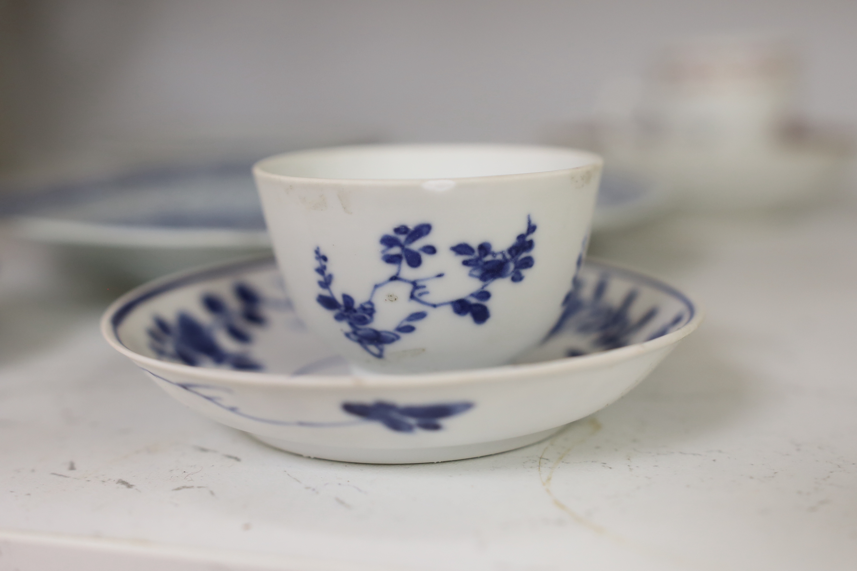 An 18th century Chinese export famille rose teacup and saucer, a similar blue and white octagonal dish, two teabowls and saucers and a plate, largest 23cm